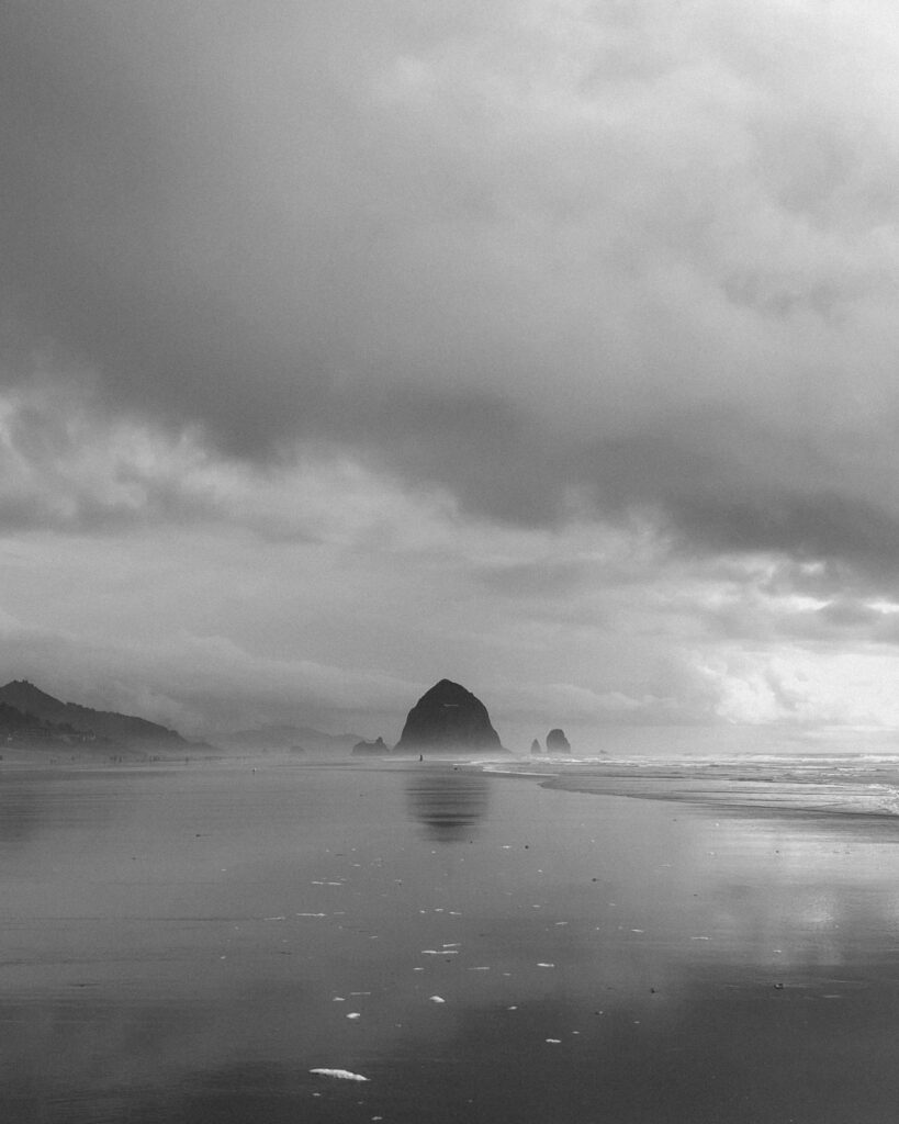 Moody black-and-white ocean landscape representing introspection, emotional depth, and personal reflection